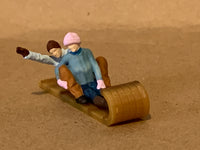 Snow Sledding Couples