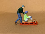 Snow Sledding Couples