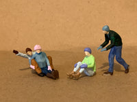 Snow Sledding Couples
