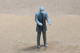 Man Standing Long Coat Cap